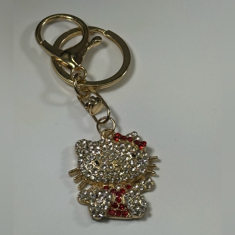 BAG CHARM Hello Kitty Gold Tone Red Crystal Hair Bow Bag Charm Keychain
